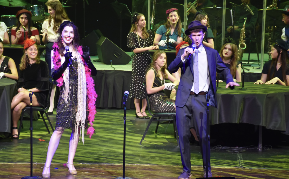 Juniors Irene Pletcher and Eli Mayer perform at the concert.